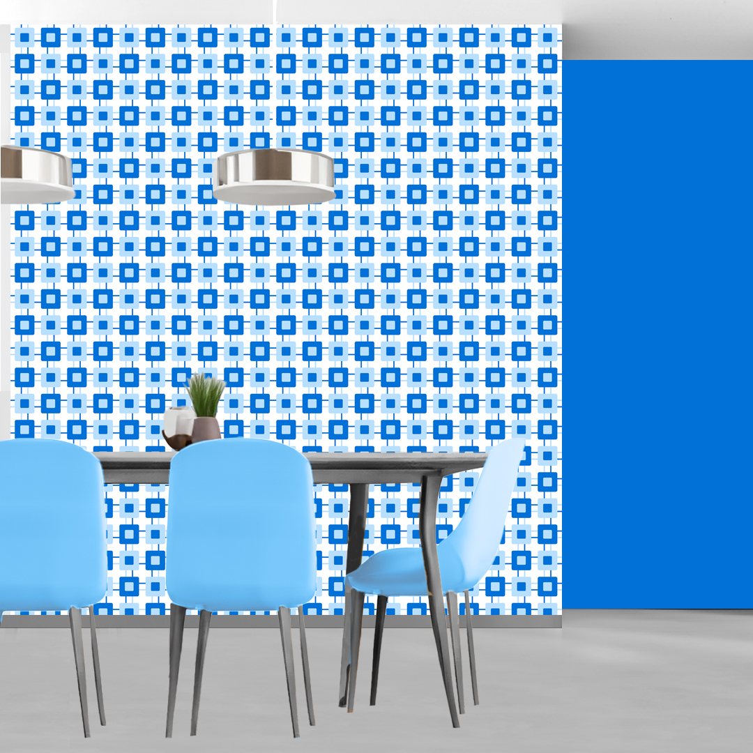 The artwork features a repeating geometric pattern of symmetrical shapes resembling elongated, curved diamonds or petals in various shades of blue and green. Each shape is split vertically with one half filled with a light blue and the other half filled with green or darker blue. The background is a light, almost pastel blue, which provides a soft yet vibrant backdrop. One of the blue shapes near the upper left contains a white starburst element, adding a focal point of brightness to the composition. The overall design conveys a modern, mid-century aesthetic with clean lines and harmonious color contrasts.